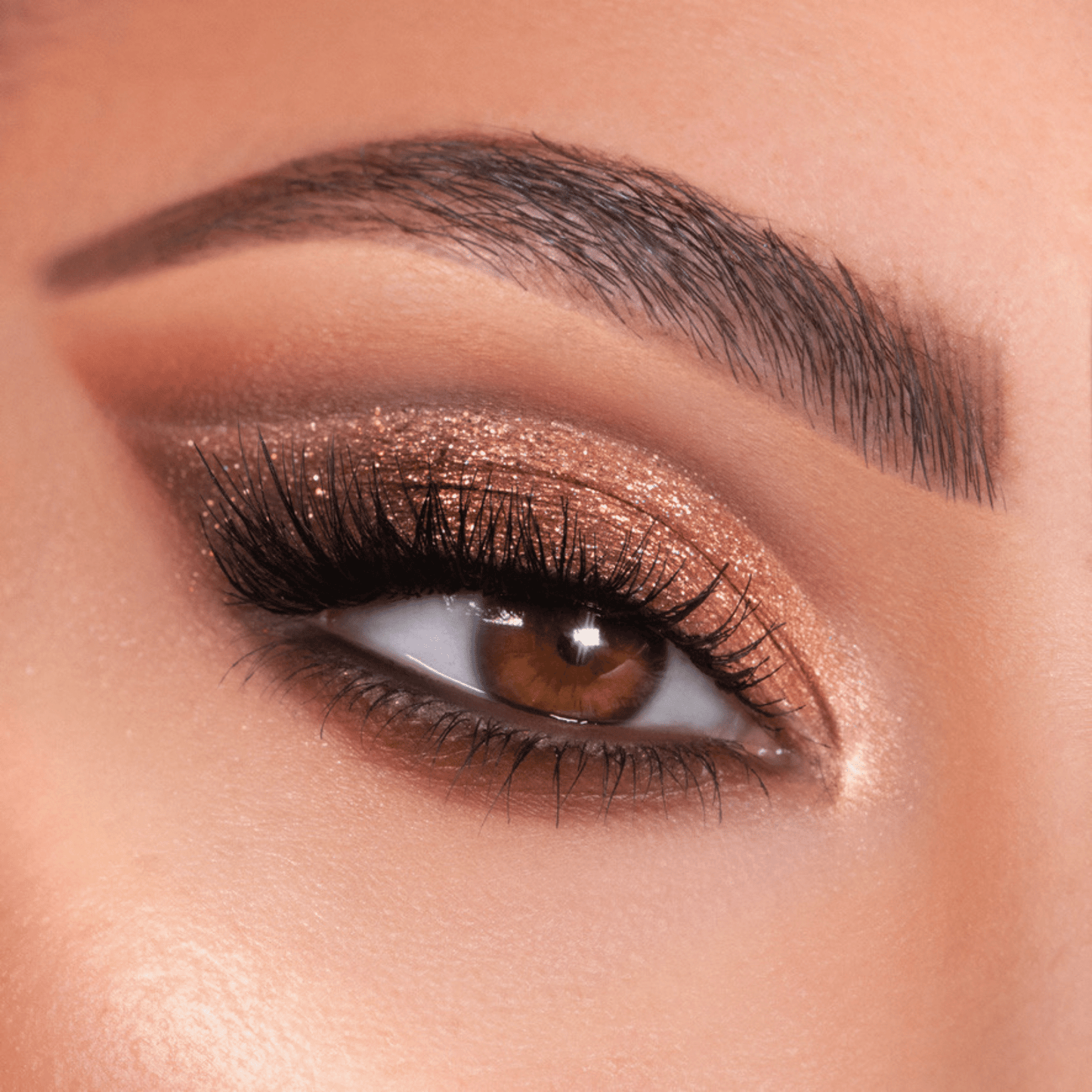 Bronze shimmer eye look showcases Bare Necessities ColourPop Shadow Palette, blending warm matte neutrals with copper glitter on the lid, soft brown crease, and champagne inner-corner highlight, framed by full lashes and a groomed brow.