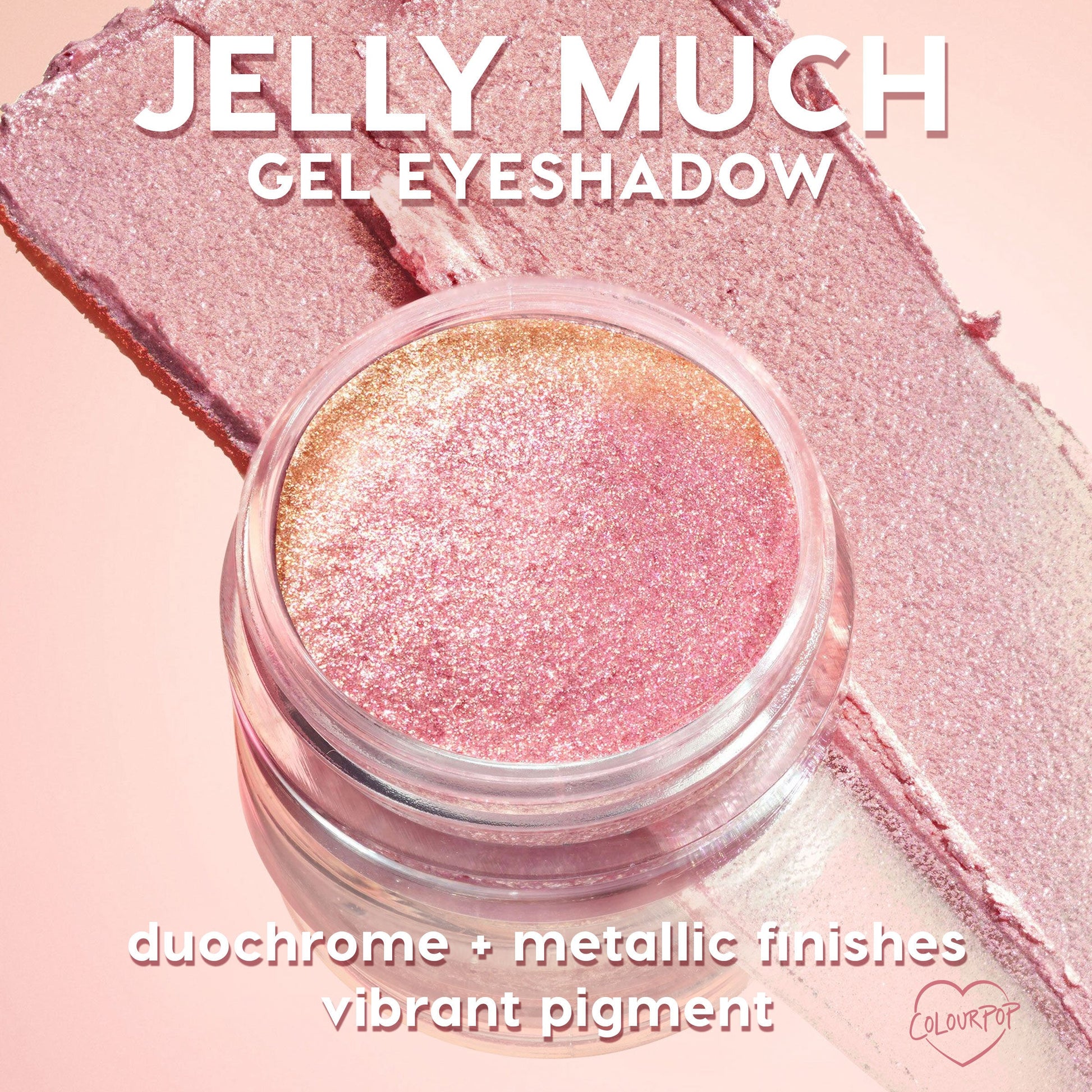 ColourPop Jelly Much Shadow Boo-Kay sparkles in an open glass jar, a pink-to-gold duochrome gel eyeshadow with metallic shimmer, shown swatched in smooth wide strokes on a soft pink background.